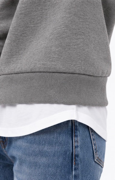 Dettaglio del fondo della felpa donna Bitsy Tiffosi grigia con bordo a coste e inserto effetto camicia bianca