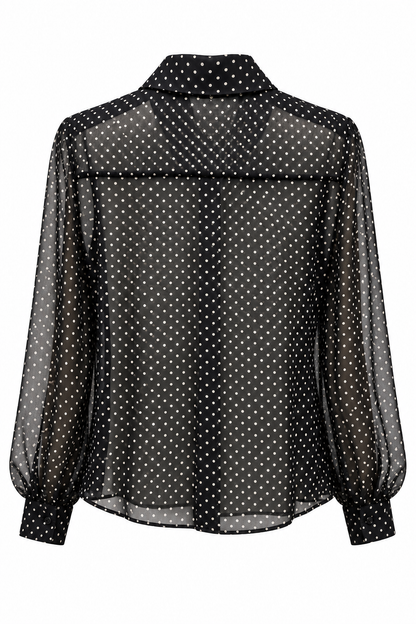Camicia donna Erica Bellucci nera a pois color fango vista sul retro su fondo bianco, con collo francese e maniche lunghe con polsini abbottonati.