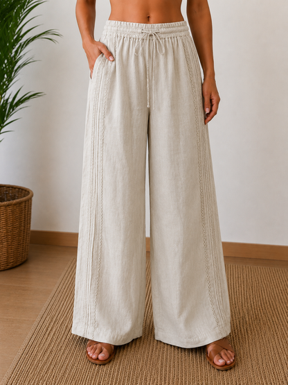 Pantalone palazzo in lino beige - gamba larga alta vita - vista frontale indossato da modella - Made in Italy - Frarò