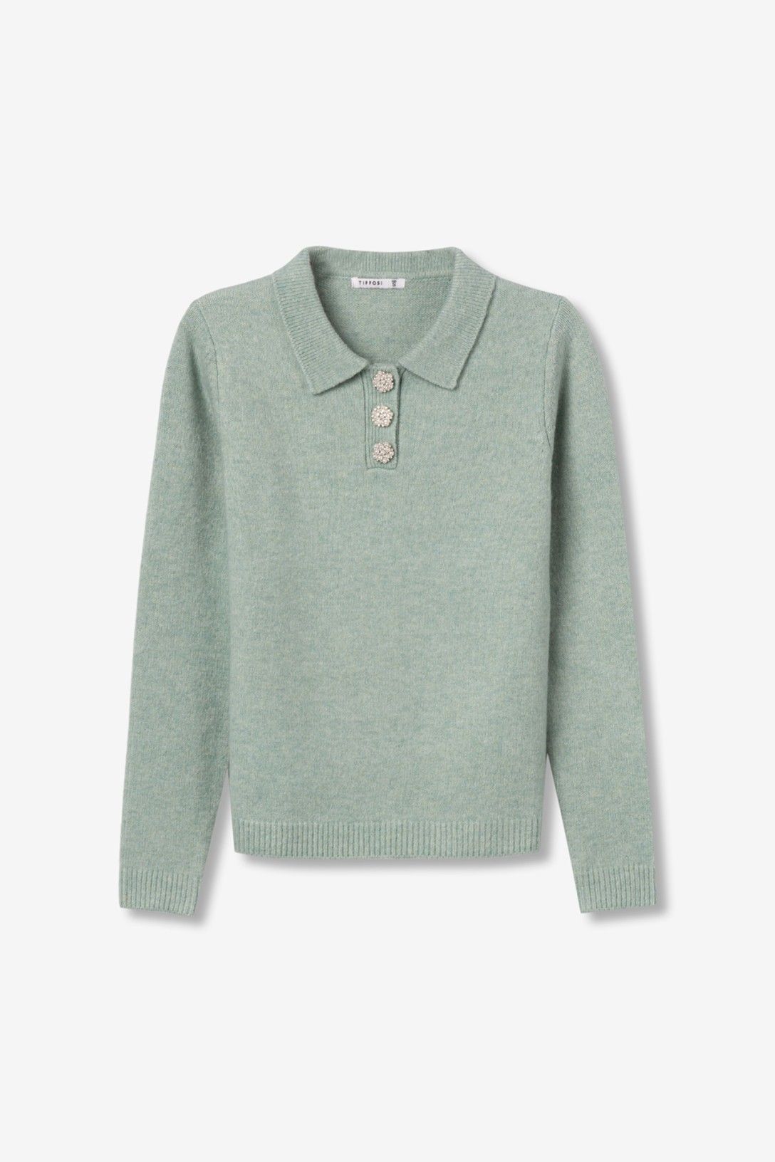 Maglia donna Marilyn verde chiaro stesa su sfondo bianco, con colletto polo, bottoni gioiello e bordo inferiore a coste.