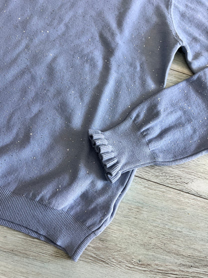 "Dettaglio tessuto lurex viscosa - effetto luminoso e morbido al tatto"