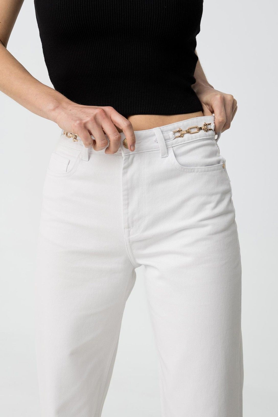 "Jeans Bonny 46 - Dettaglio delle fibbie d'orate sul bustino, tessuto semi elastico in cotone"