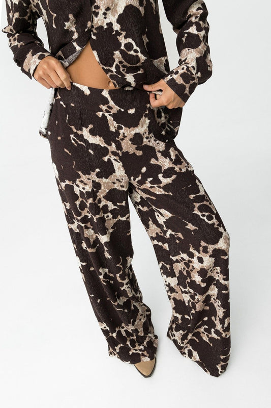 "Pantalone palazzo donna Qatar_B con stampa animalier all-over, vita elastica e vestibilità comoda - Vista frontale"