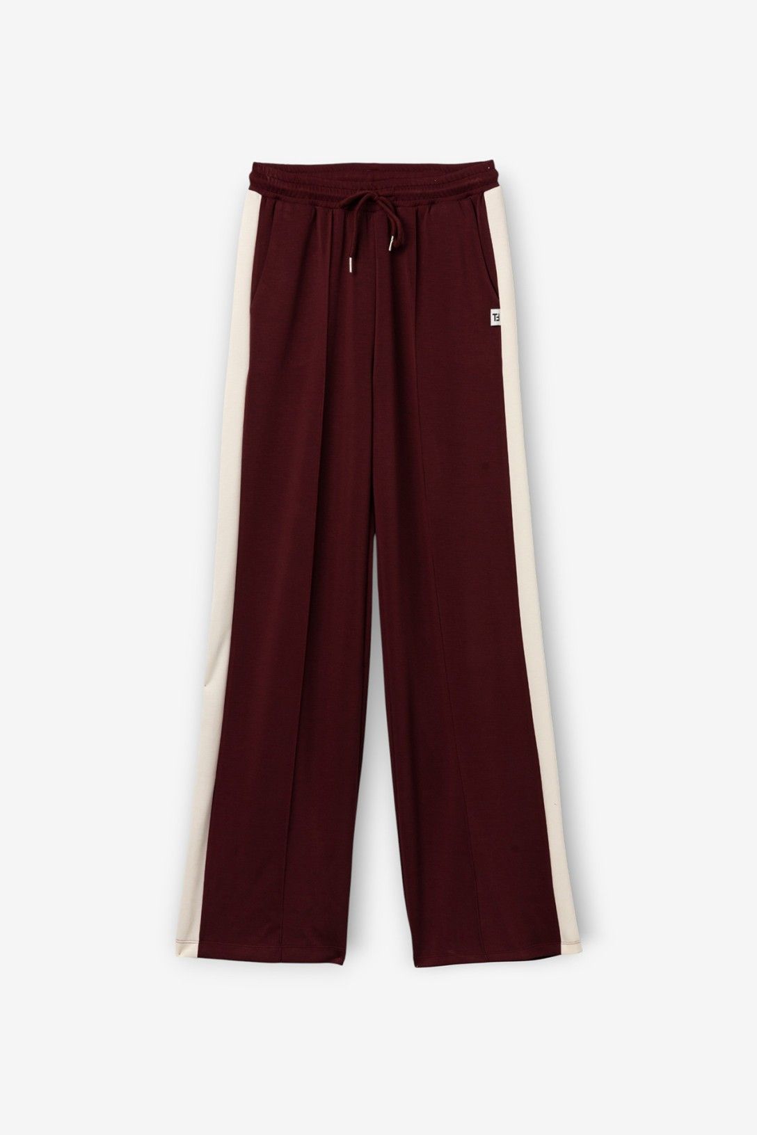 Pantalone della tuta donna Vanny Tiffosi magenta a gamba larga con elastico e coulisse in vita, bande laterali bianche.